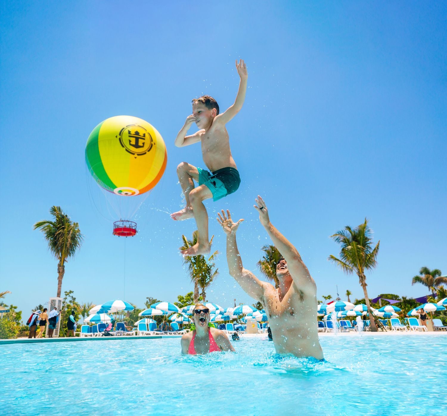 Family relaxing at the Oasis Lagoon pool